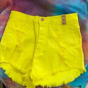 Yellow distressed shorts